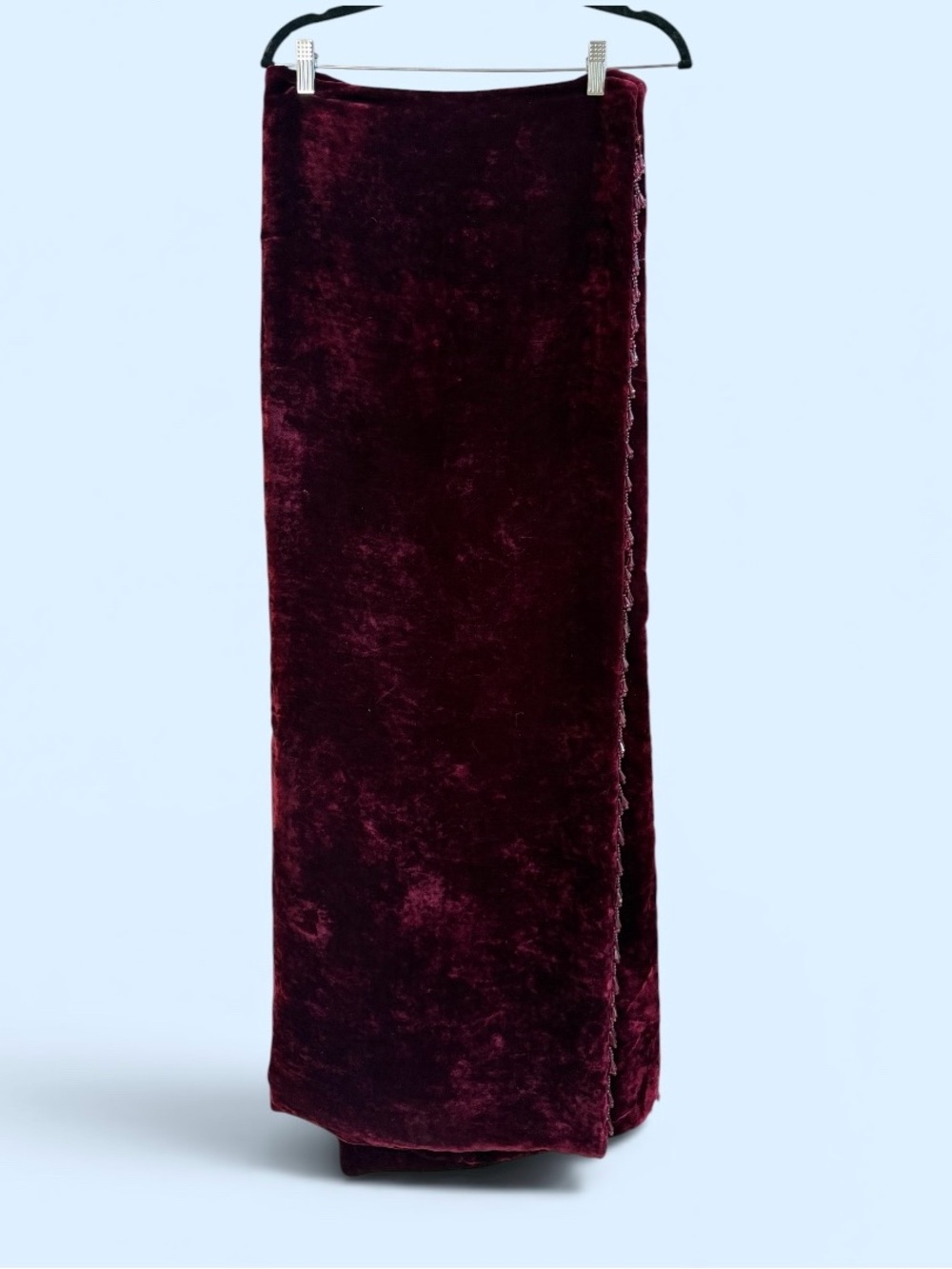 Burgundy velvet throw blanket with beaded detail